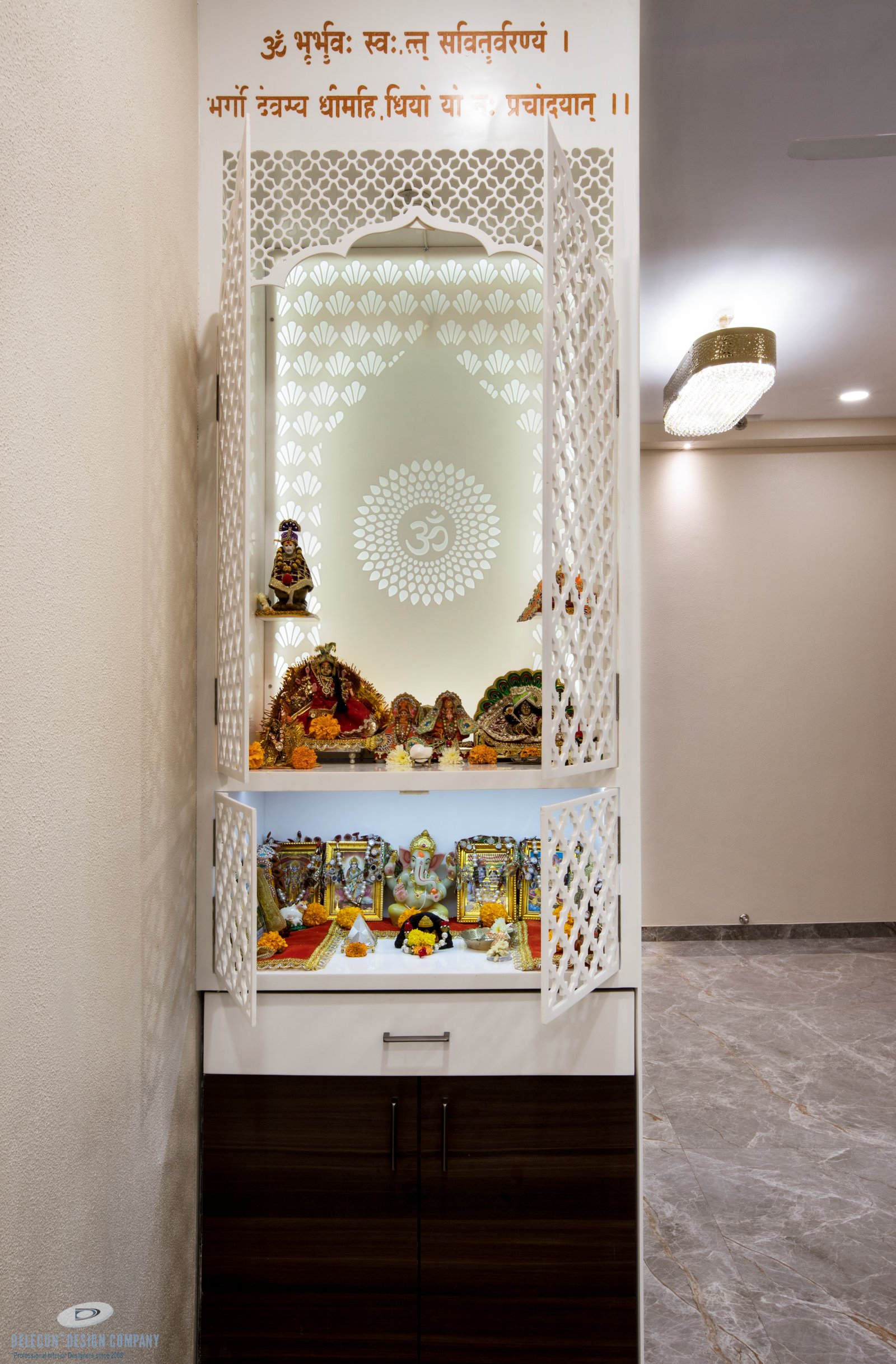 Mandir design with soft lighting in living area at Sai World City Panvel